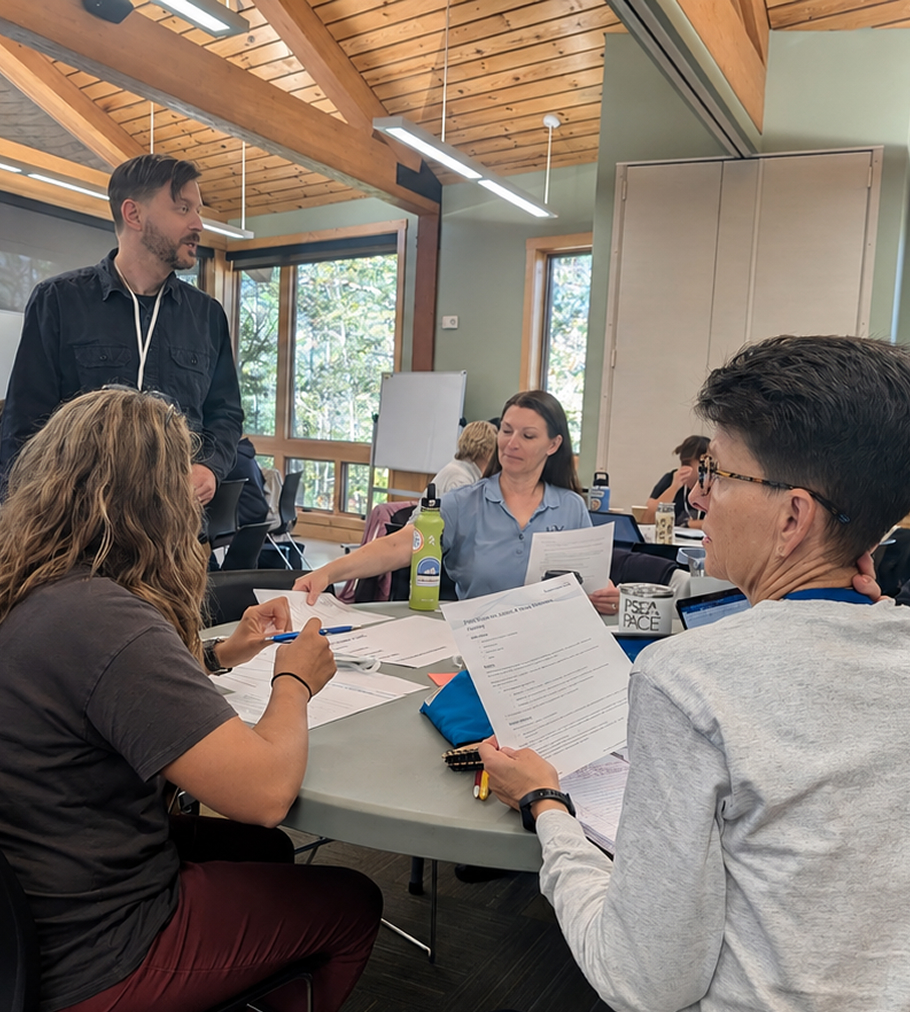 Academic reviewers discussing student work
