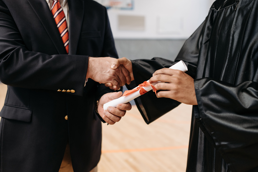 A graduate receiving a certificate